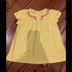 Oshkosh Girls Size 5T top. Yellow with pink flowers. 100% cotton and soft.